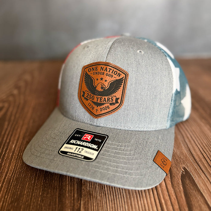 One Nation Under God | America 250 Leather Patch Trucker Hat