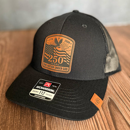 One Nation Under God | America 250 Leather Patch Trucker Hat